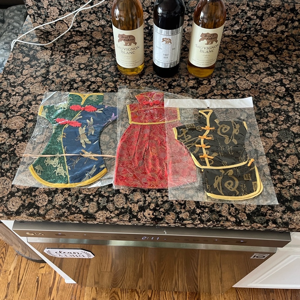 NWT Set of three bottle covers in red, blue, and black with gold